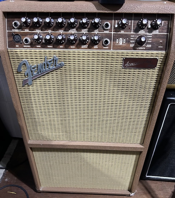 Fender Acoustasonic SFX PR370 Looking for rich, natural acoustic tone and versatile performance features? This used Fender Acoustasonic SFX PR370 Acoustic Guitar Combo Amp is in Good condition and delivers 2-channel flexibility with a spacious stereo sound. Featuring 80 watts of power through a 6.5” speaker and a side-mounted tweeter for Stereo Field Expansion (SFX), it offers warm, room-filling audio — perfect for solo gigs or practice. Each channel includes volume, bass, mid, treble, notch filter, reverb, and phase controls for precise tone shaping. The amp also includes built-in digital reverb and delay effects, balanced XLR input for microphones, and an auxiliary RCA input for backing tracks. Rugged and road-ready, this combo makes a reliable partner for any acoustic performance.